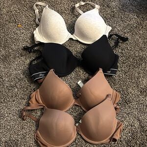 PINK Victoria's Secret Black, White, and Tan Bra Trio